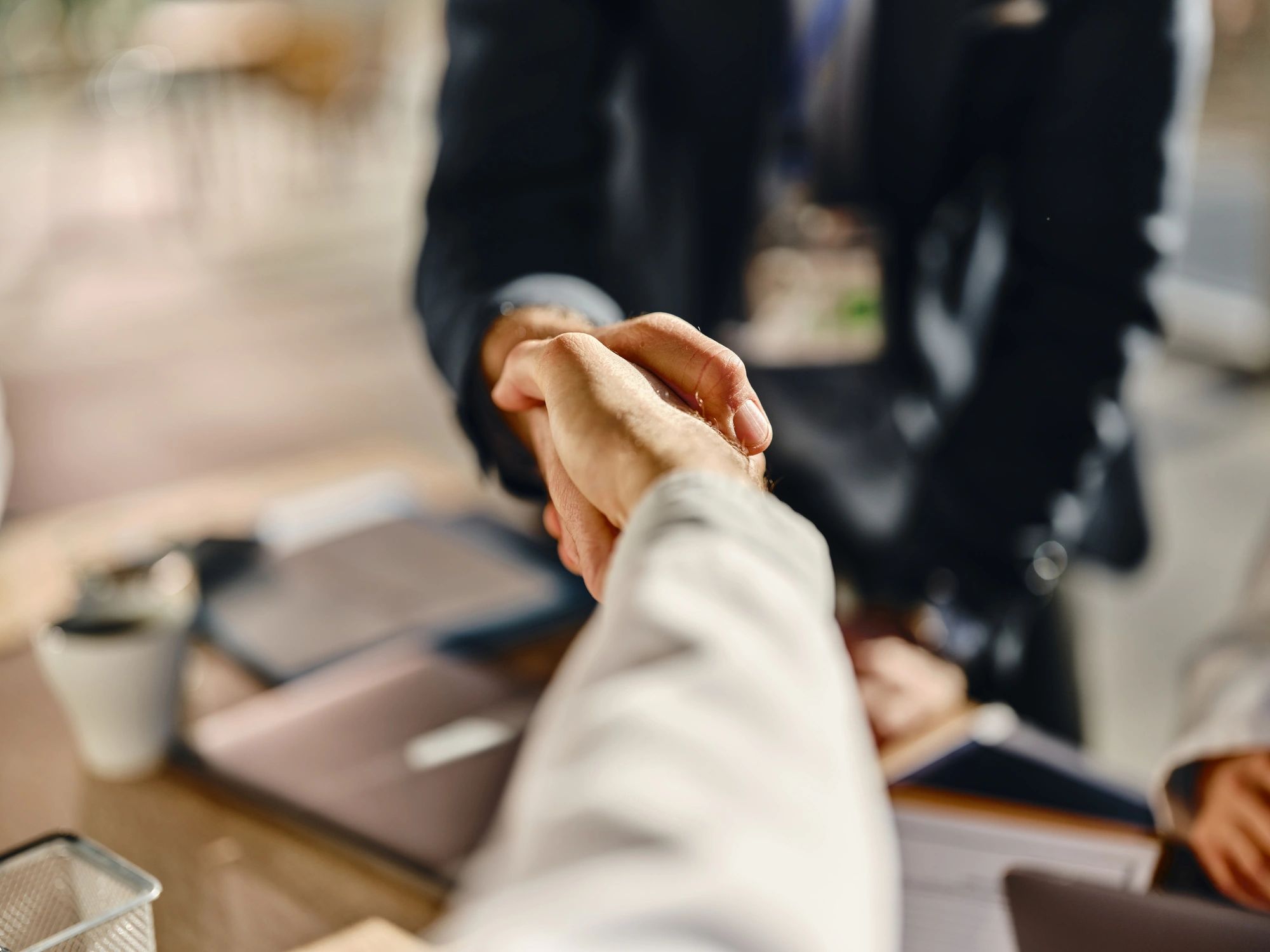 Handshake close-up representing alignment and agreement