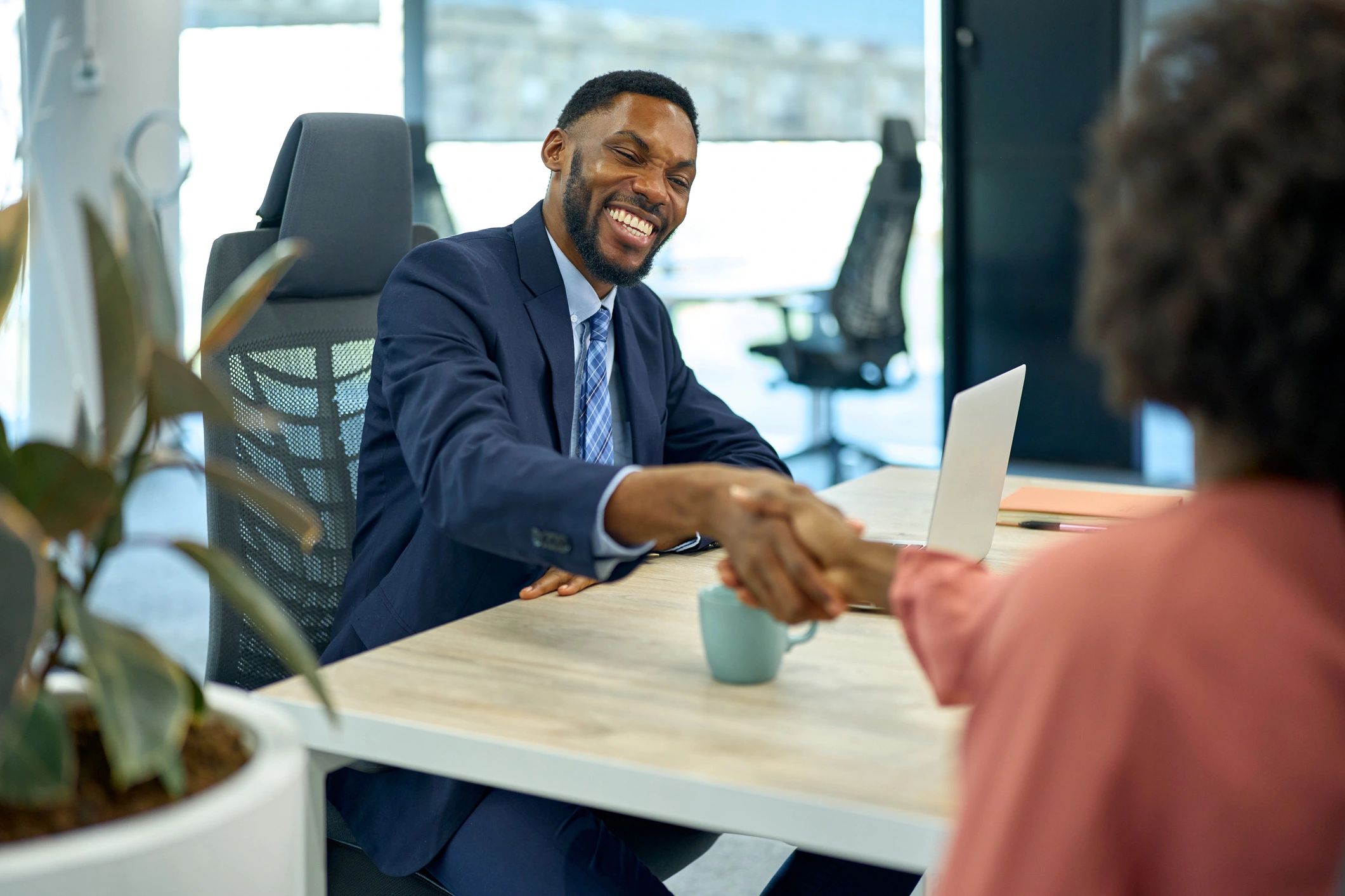 Business man shaking hands making office deal