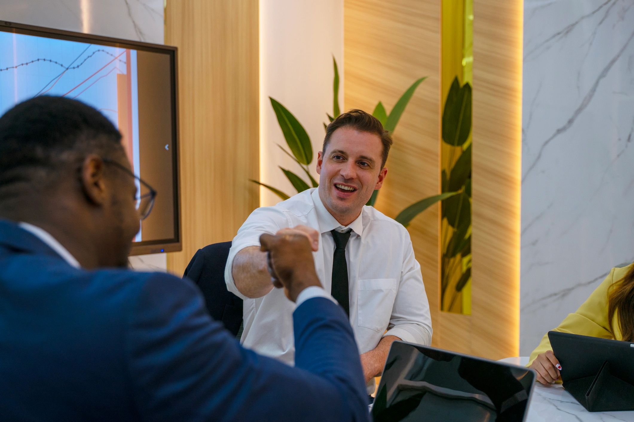 Business advisors meeting around a conference table before a transaction process begins